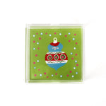 a small green square Acrylic Trays with Ornament motif on it on a white background