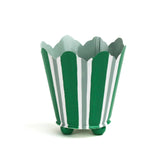 Green and white striped tole cachepot with scalloped rim and rounded green feet, standing upright.