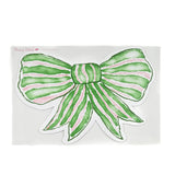 Green and pink bow paper placemat on a white background