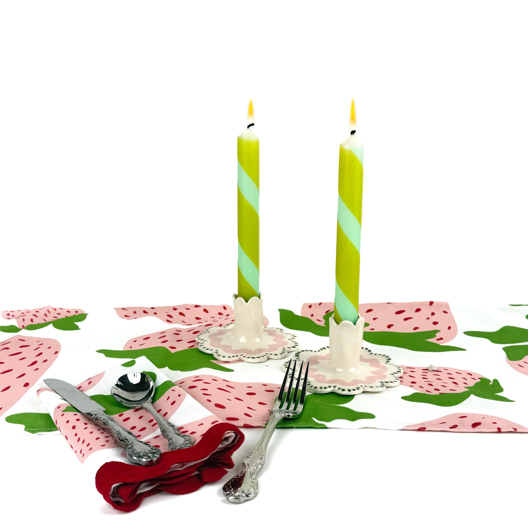 Green and blue candy stripe taper candles set with twisted spiral design for spring table decor.