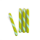 Green and blue candy stripe taper candles set with twisted spiral design for spring table decor.