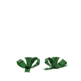 set of green bow shaped candle holders with glossy finish on white background