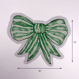 Green bow shaped Christmas paper placemat with ribbon design, 18 by 14 inches, Christmas tea towel