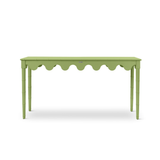 A green console table with scalloped edges