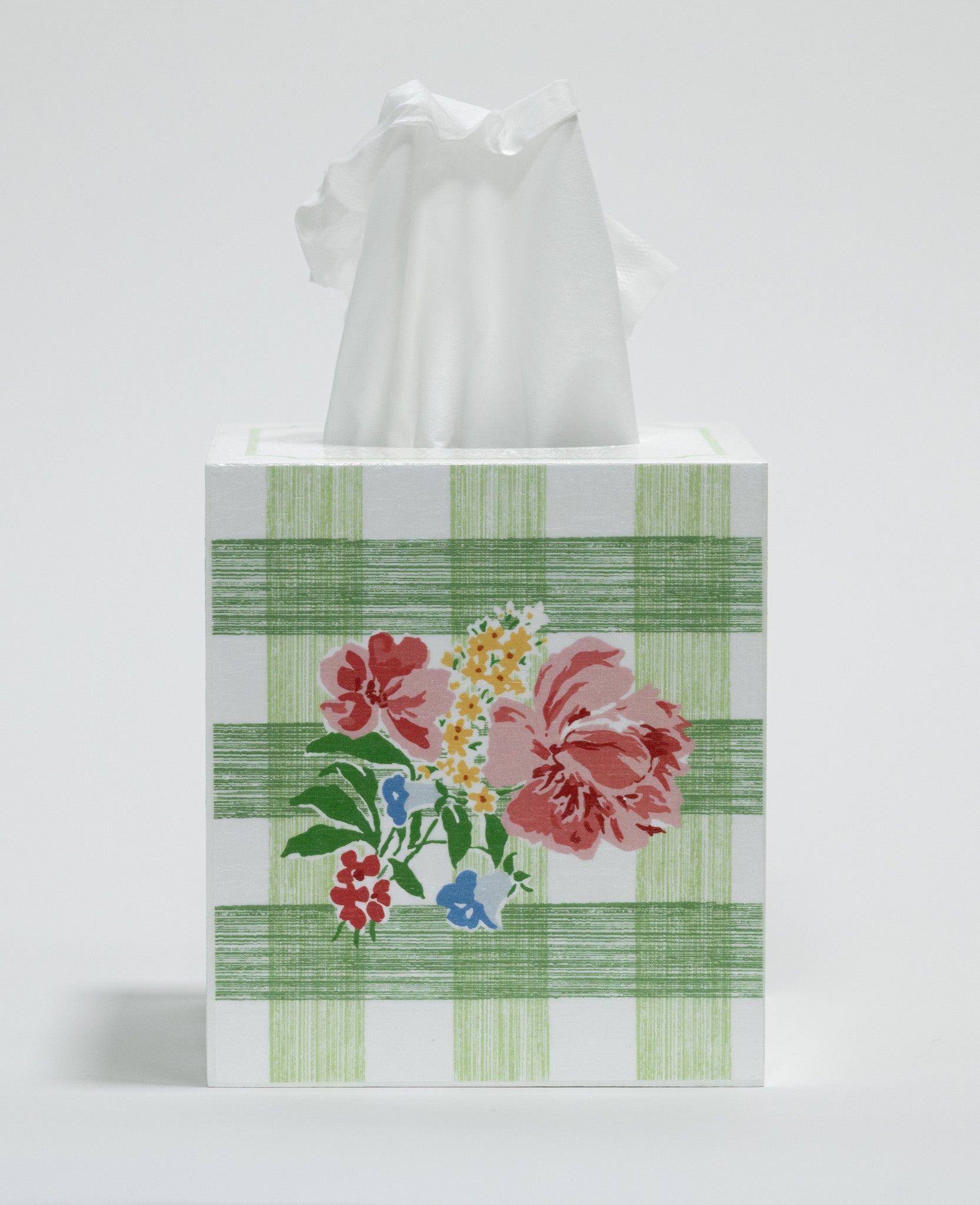 Tissue box cover with floral design and green plaid pattern on a white background