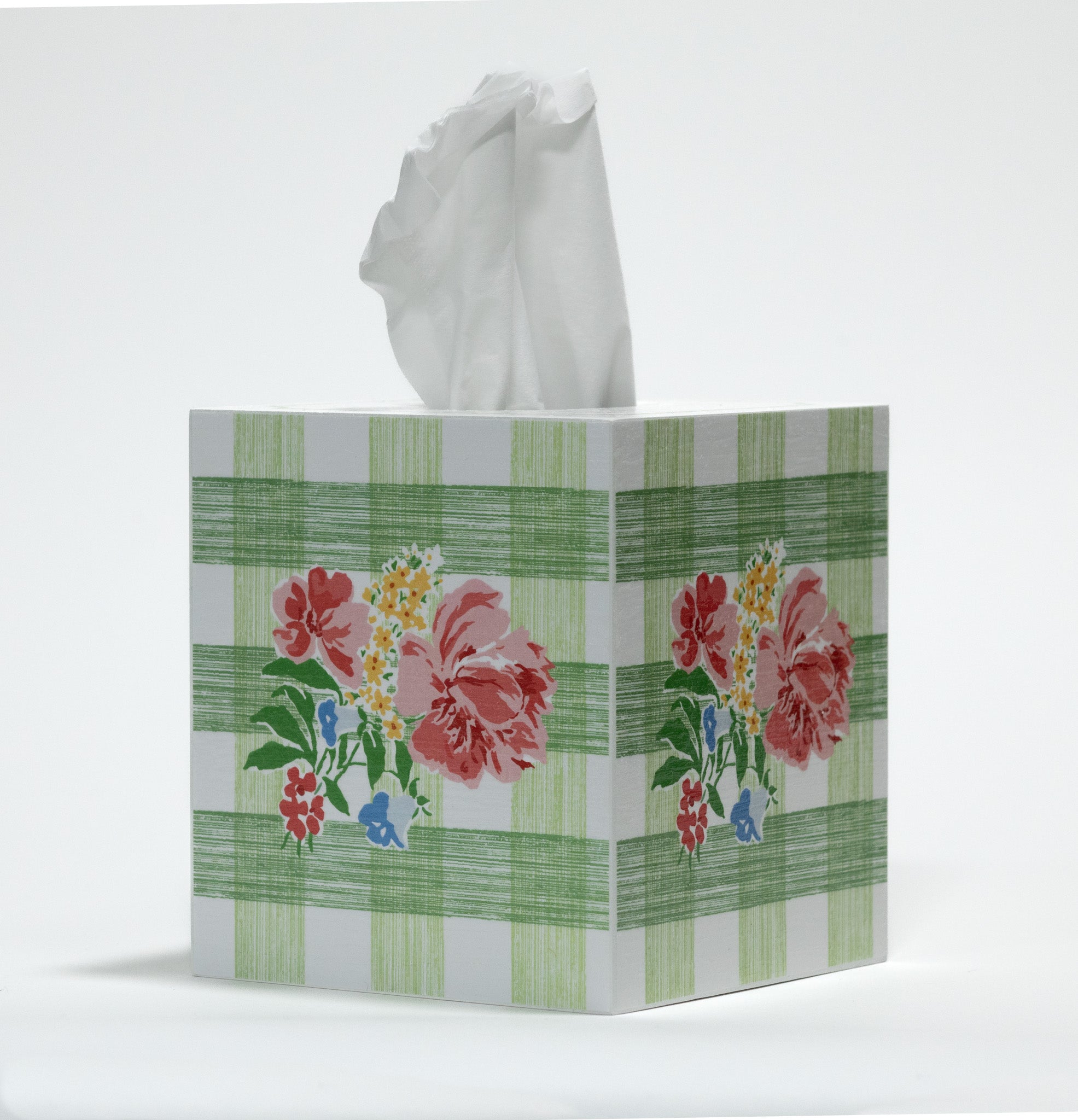Tissue box with floral green gingham design on a white background