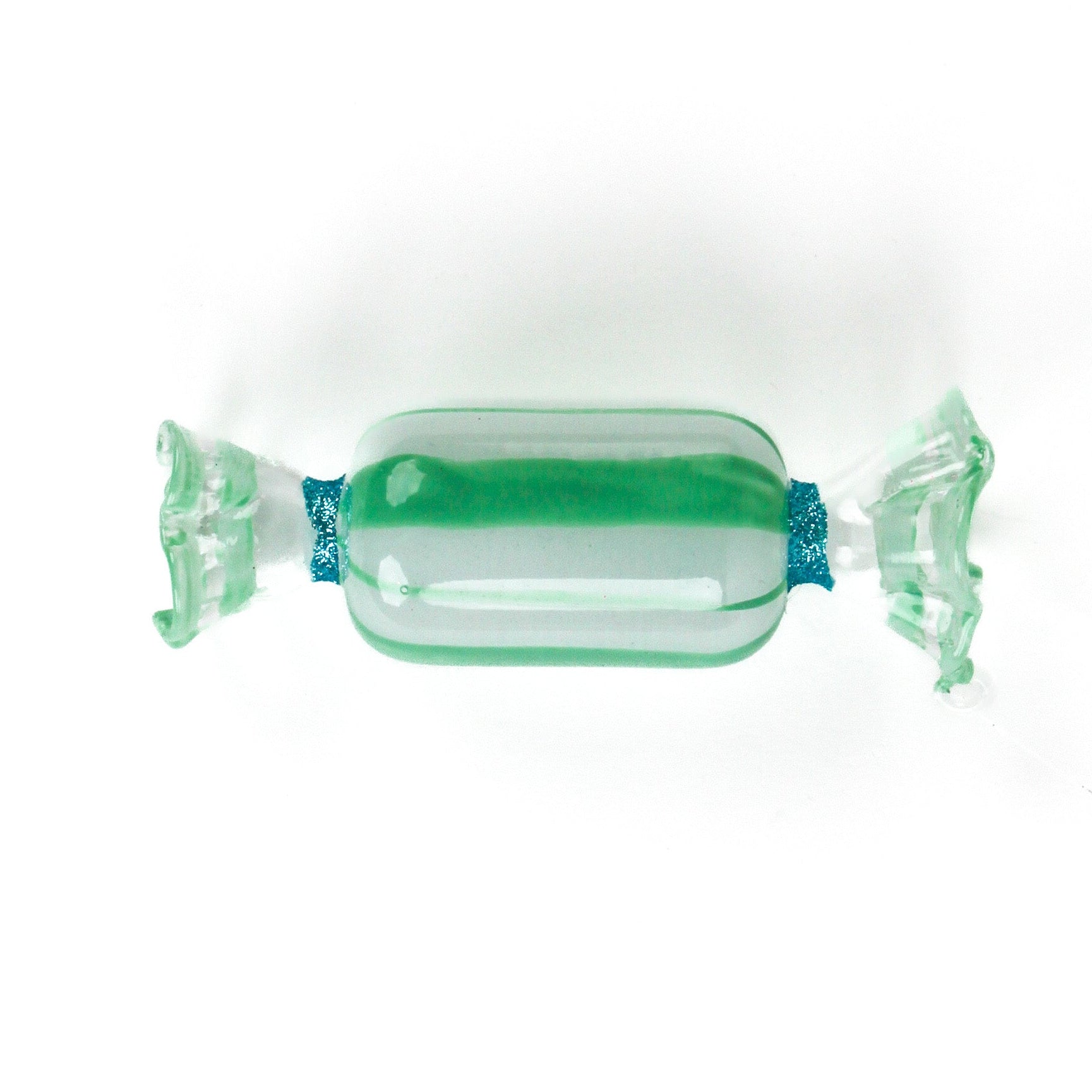 Green glass candy christmas ornament on a white background