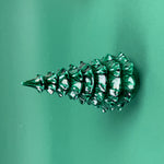 Side view Green marbled Christmas tree ornament on a solid green background