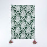 Green pineapple pattern Christmas tea towel with pink and green tassels on each corner