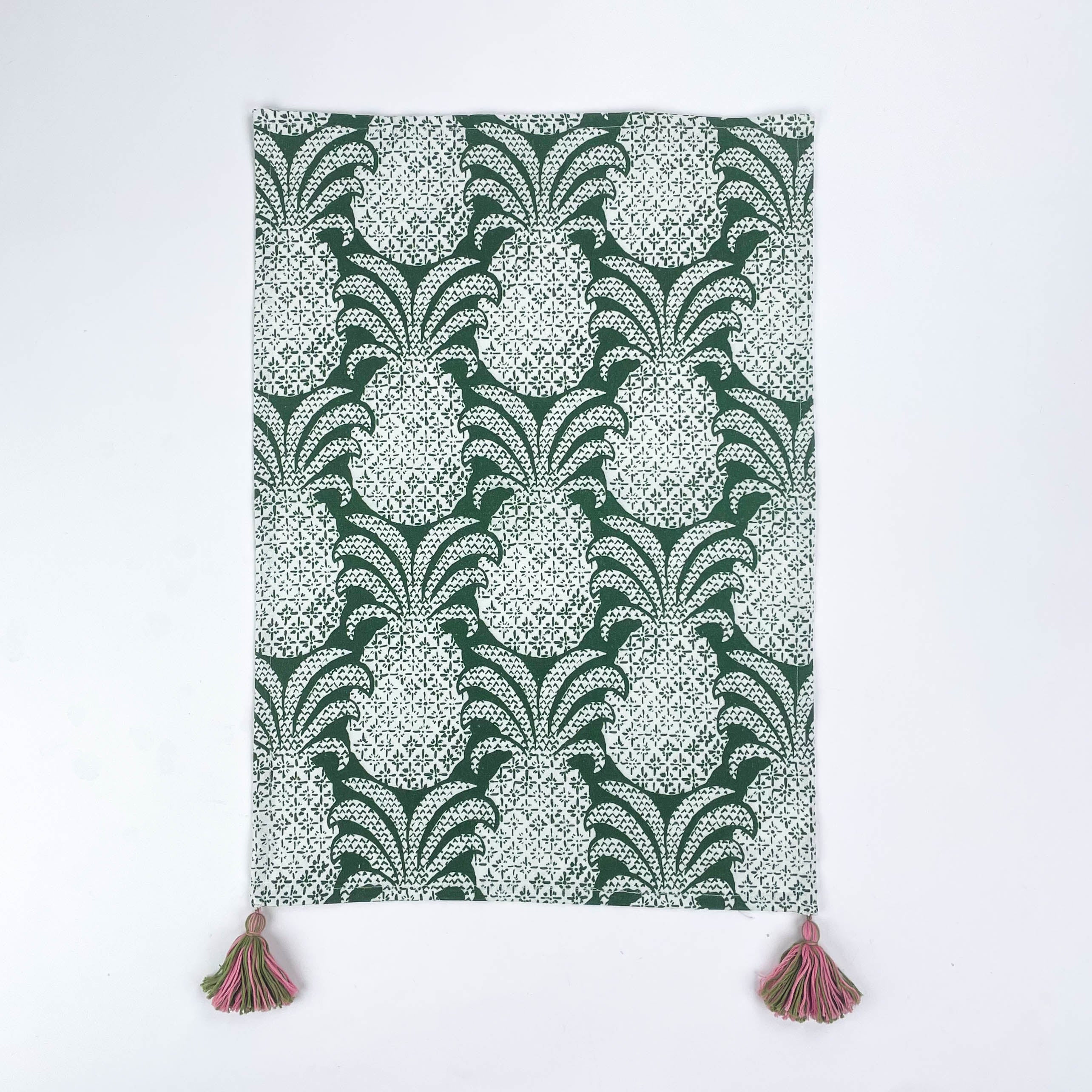 Green pineapple pattern Christmas tea towel with pink and green tassels on each corner