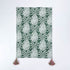 Green pineapple pattern Christmas tea towel with pink and green tassels on each corner