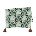 a green pineapple tea towel with pink and green tassels against a white background 
