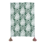a green pineapple tea towel with pink and green tassels against a white background 