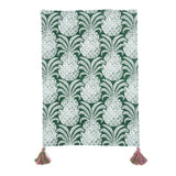 a green pineapple tea towel with pink and green tassels against a white background 
