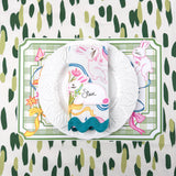 spring Easter paper placemat with bunny place card, white plate, and green striped napkin.