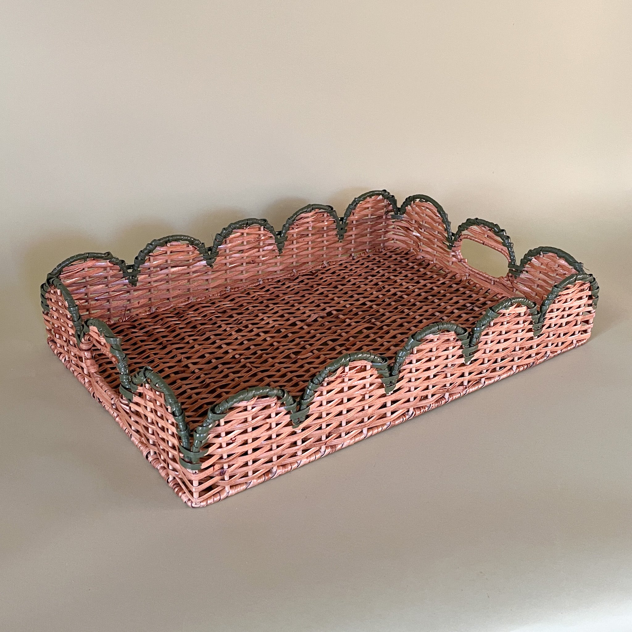 green rattan serving tray front 3/4 view with handles