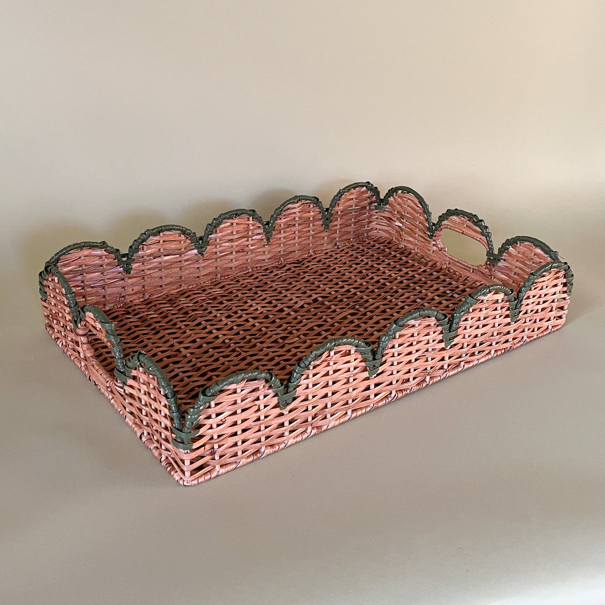 green rattan serving tray front 3/4 view with handles