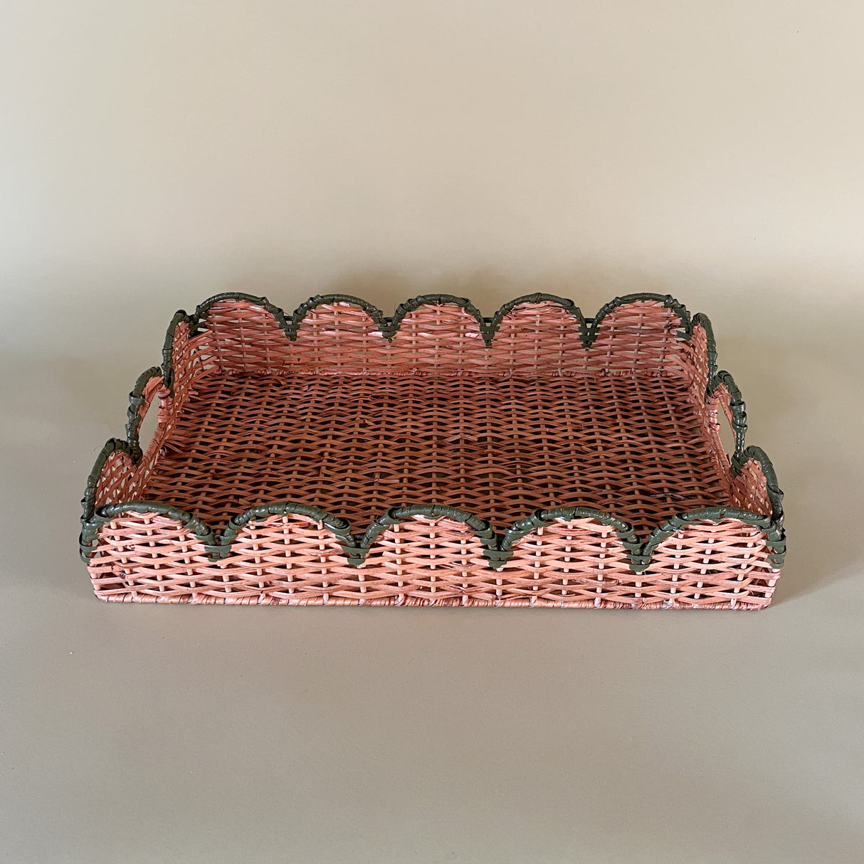 green rattan serving tray side view