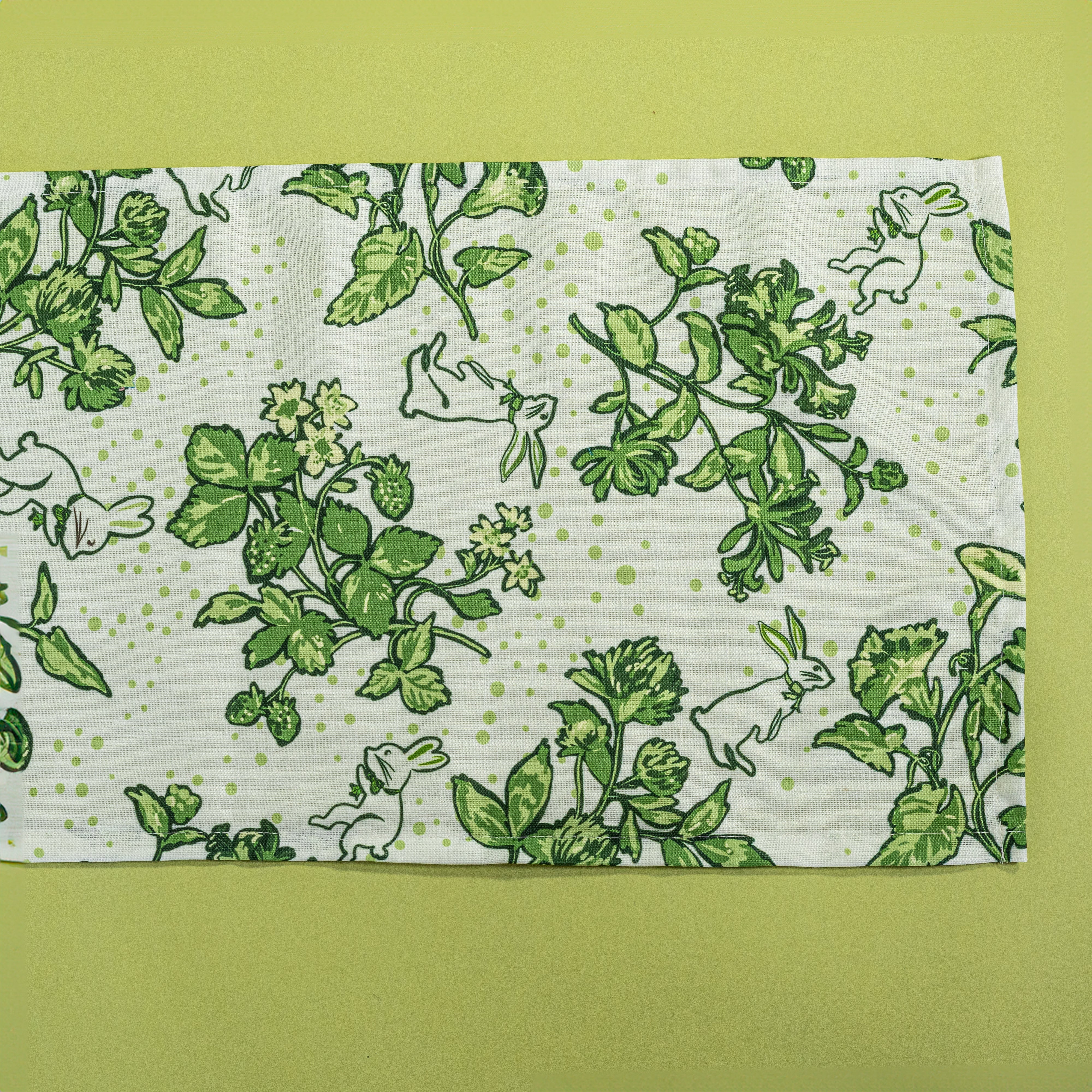 a springtime strawberry print fabric easter table runners in green