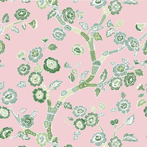 green, pink and white chinoiserie wallpaper featuring green cherry blossom motifs on a pink background. 