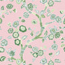 green, pink and white chinoiserie wallpaper featuring green cherry blossom motifs on a pink background. 