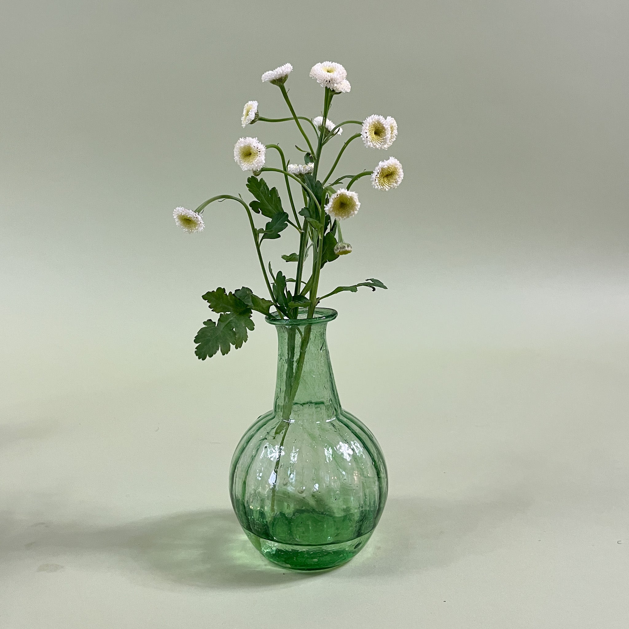 green blown glass bud vase