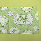 Green table runner in a vintage plates print fabric. 