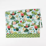 Floral Christmas tea towel featuring water lily and herom motifs