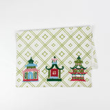 Christmas tea towel with three pagodas in red, green, pink, and blue tones, with a festive chinoiserie style.
