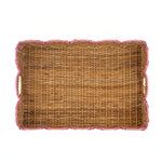 Bottom view of a rectangular woven rattan tray with scalloped edges and pink rope trim on a plain white background.