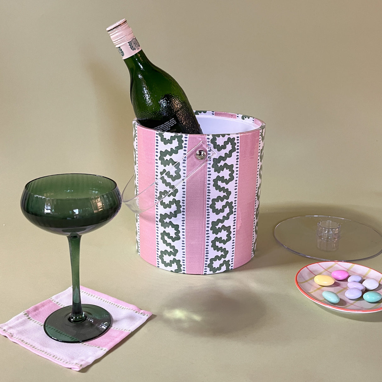 Harbor Trail Bahama Pink, a pink and green striped acrylic ice bucket containing a bottle