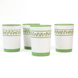set of 4 hand-made white glasses with green stripe and wavy pattern in a white background