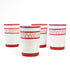 four hand-made white glasses with red stripe and pink pattern in a white background