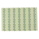 a green paper placemats featuring a striped pattern in a white background. 