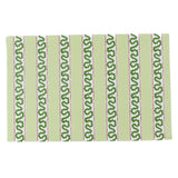 a green paper placemats featuring a striped pattern in a white background. 