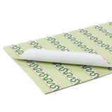 a green paper placemats featuring a striped pattern in a white background. 