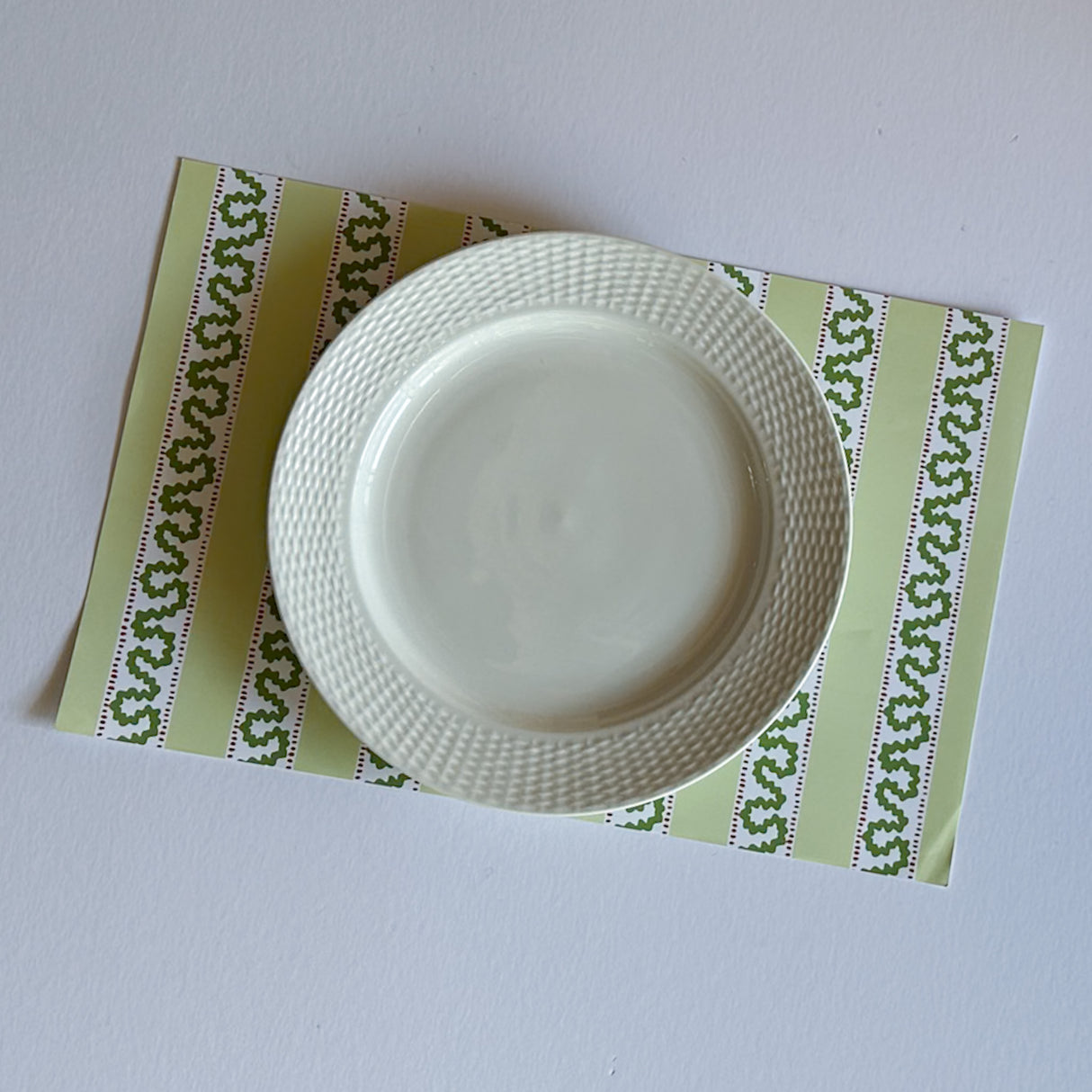 green paper placemats featuring a striped pattern from Madcap Cottage