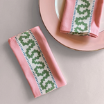 Harbor Trail patterned cloth dinner napkins on a pink plate