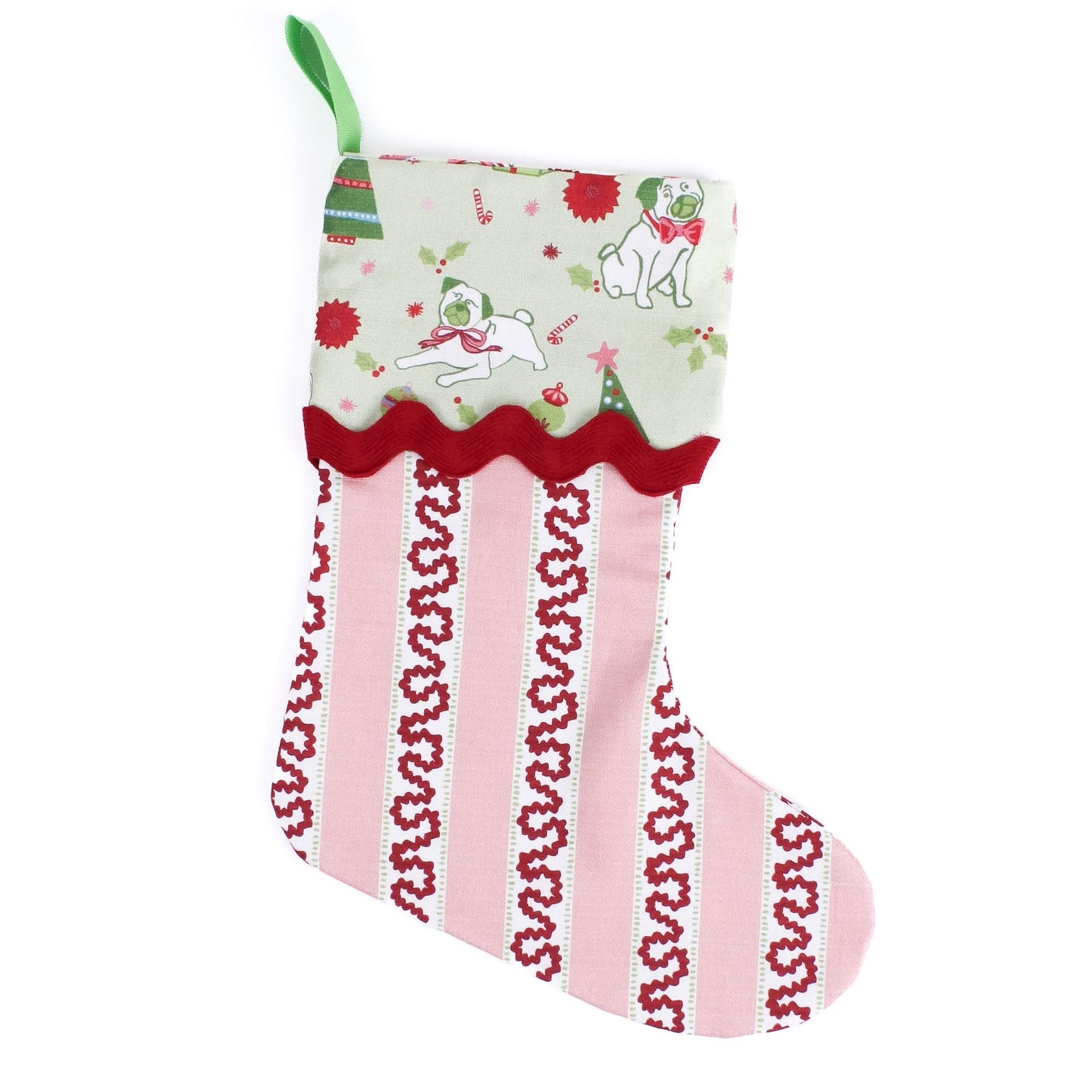 Decorative striped red and pink Christmas stocking with a green cuff with pugs on it on a white background
