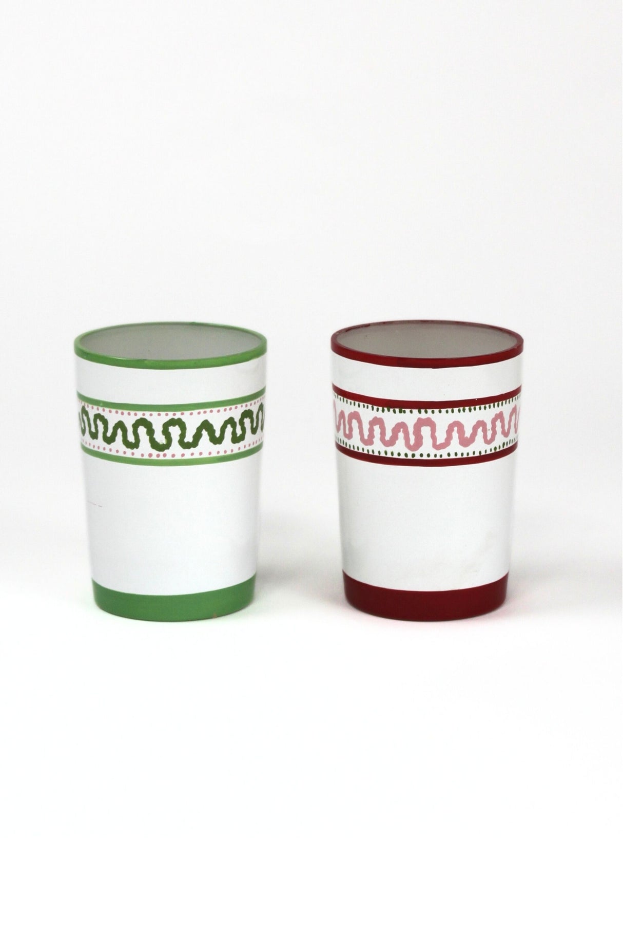 two painted glasses one green, one red with a squiggly motif at the top called "Harbor Trail" by madcap cottage