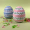 a pink and blue striped set of large decorative easter eggs