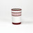 a red painted glass with a squiggly motif at the top called "Harbor Trail" by madcap cottage