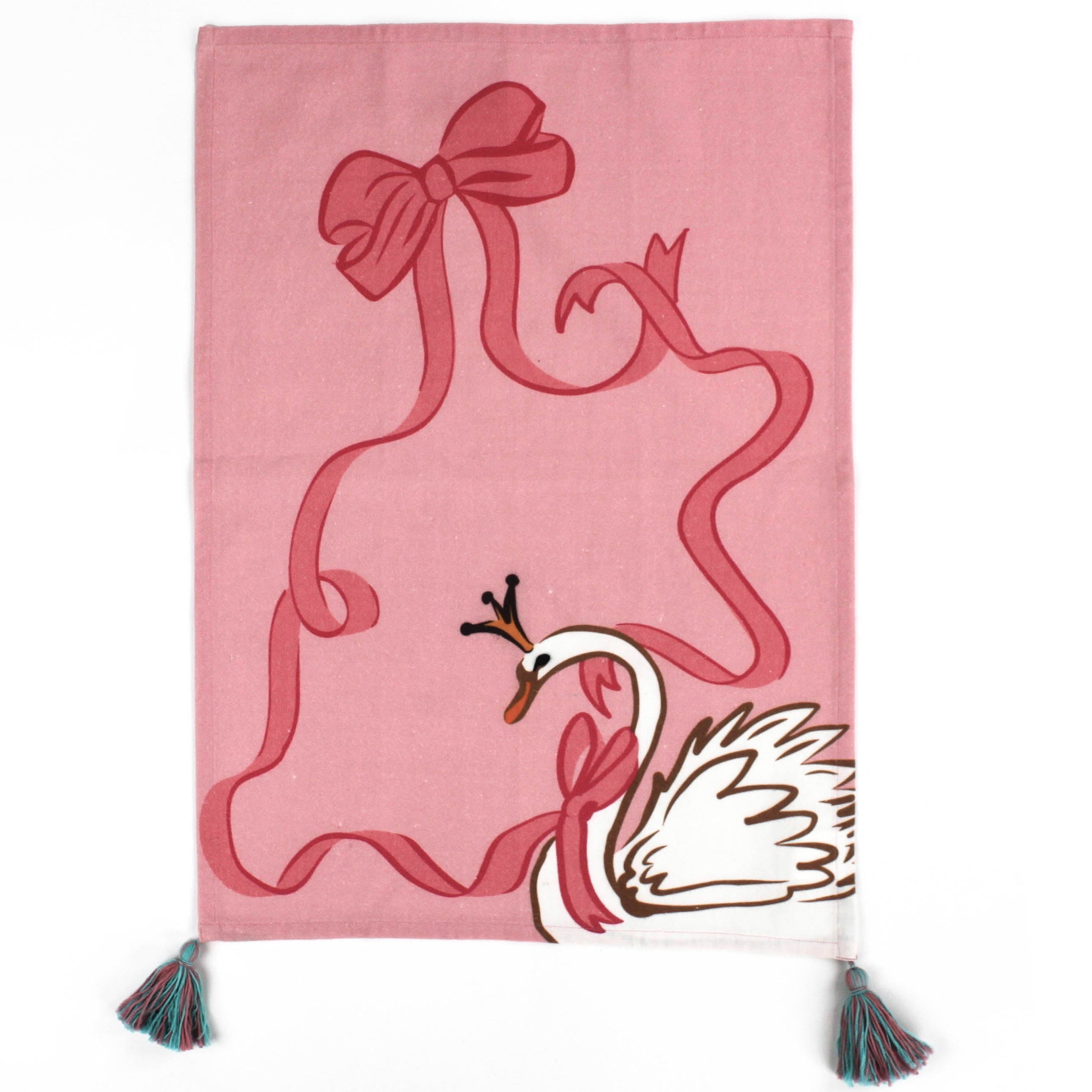 a madcap cottage pink christmas tea towel decorated with a white swan in the corner, a large pink bow motif and a tassels in two corners. 
