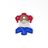 A folded red white and blue honeycomb paper bell garland decoration wrapped with string on a white background.