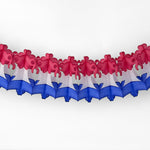 A red white and blue honeycomb paper bell garland decoration hanging against a white background.