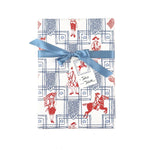 Patriotic gift wrap featuring red colonial soldiers, horseback riders, American flags, and decorative blue borders.