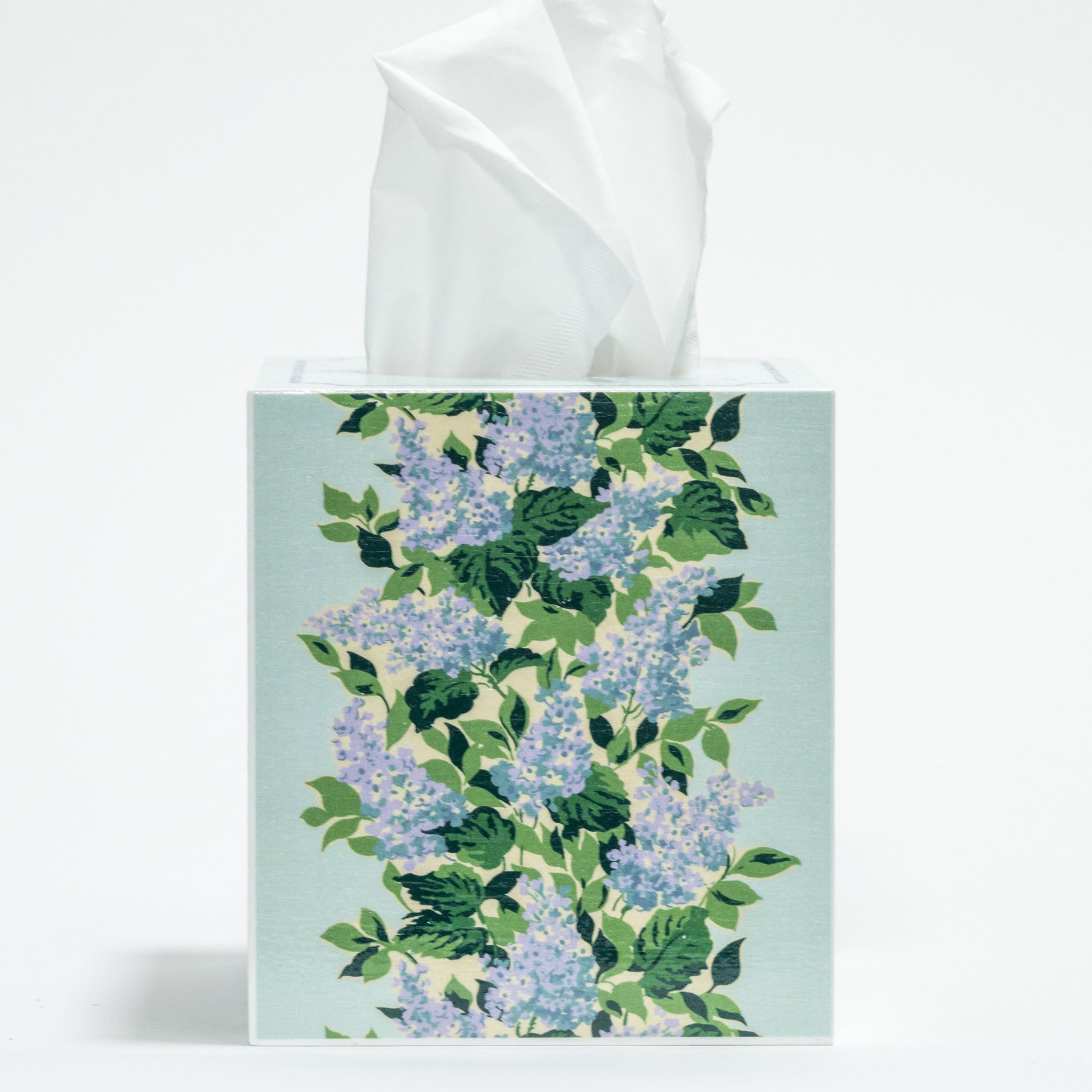 a blue floral tissue box cover with a repeating hydrangea pattern down the center of each side. 