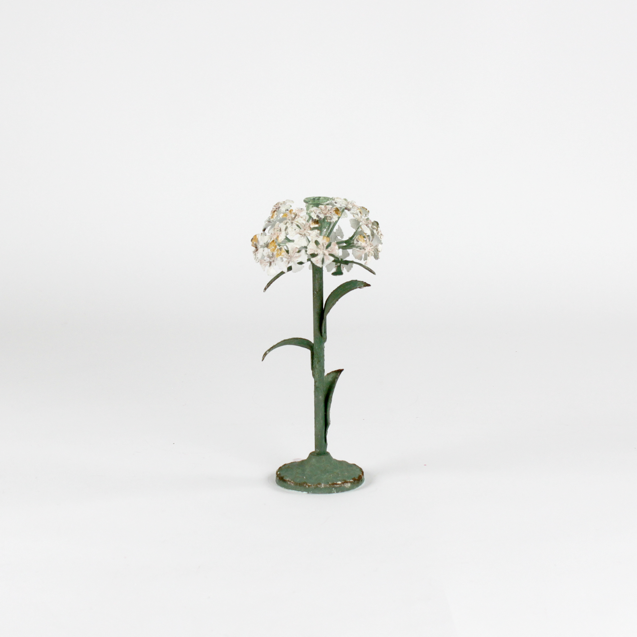 a large metal flower candle holder in the shape of a hydrangea on a white background