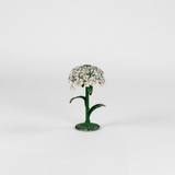 a small metal flower candle holder in the shape of a hydrangea on a white background