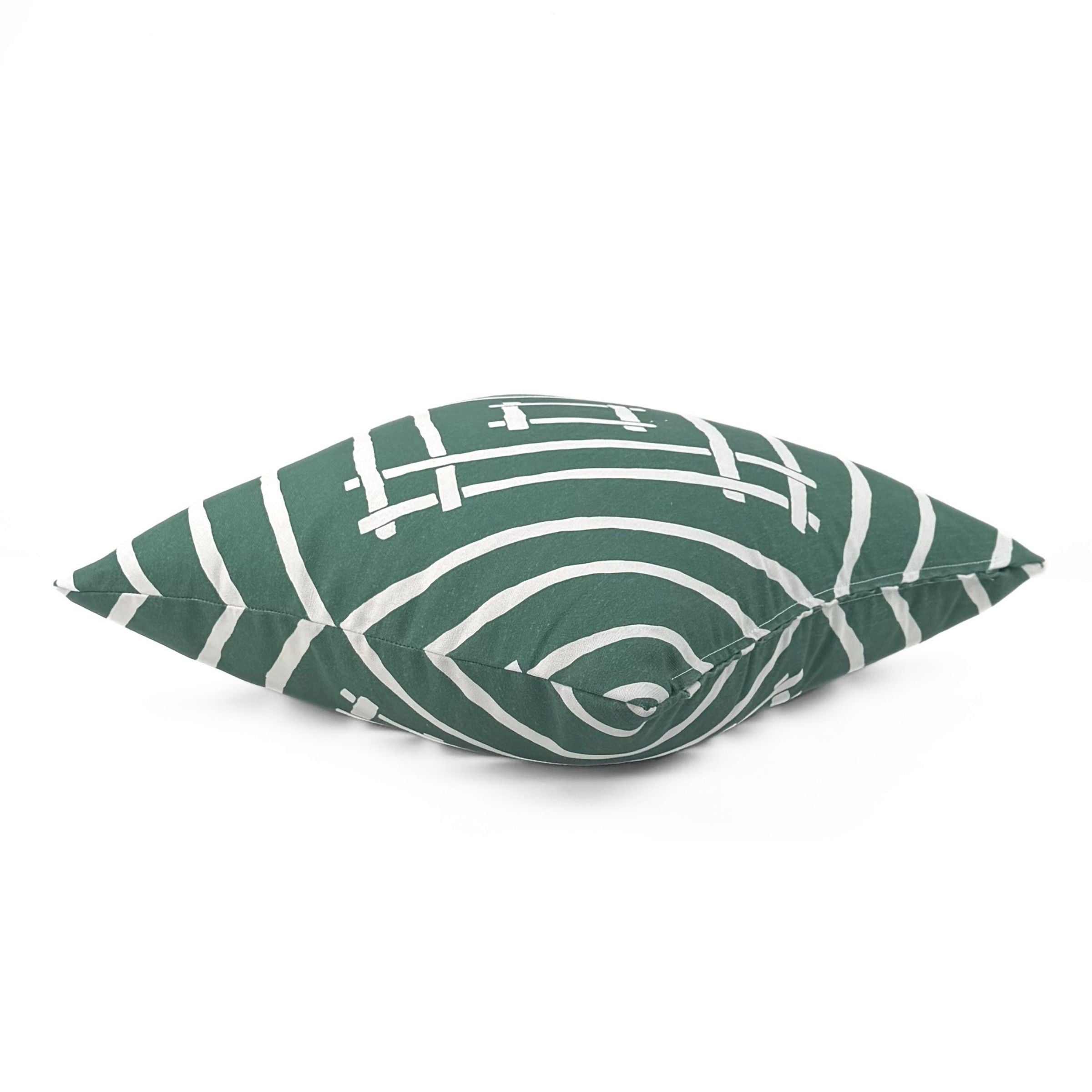 Side view of Island House Green White outdoor pillow.